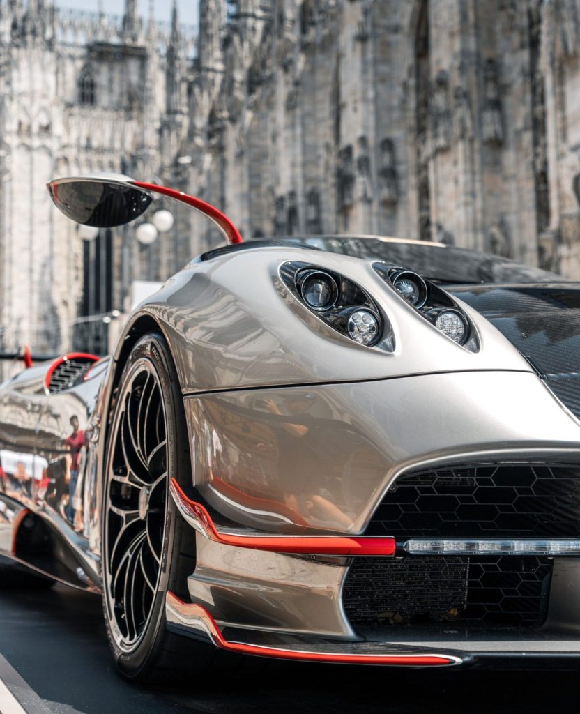 Pagani hypercar showcasing carbon fibre bodywork and signature quad headlights