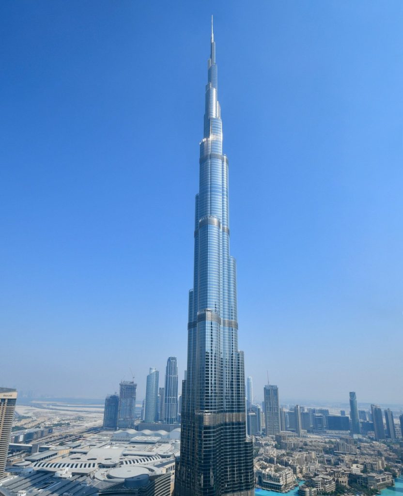 Burj Khalifa rising above the Dubai skyline under a clear blue sky