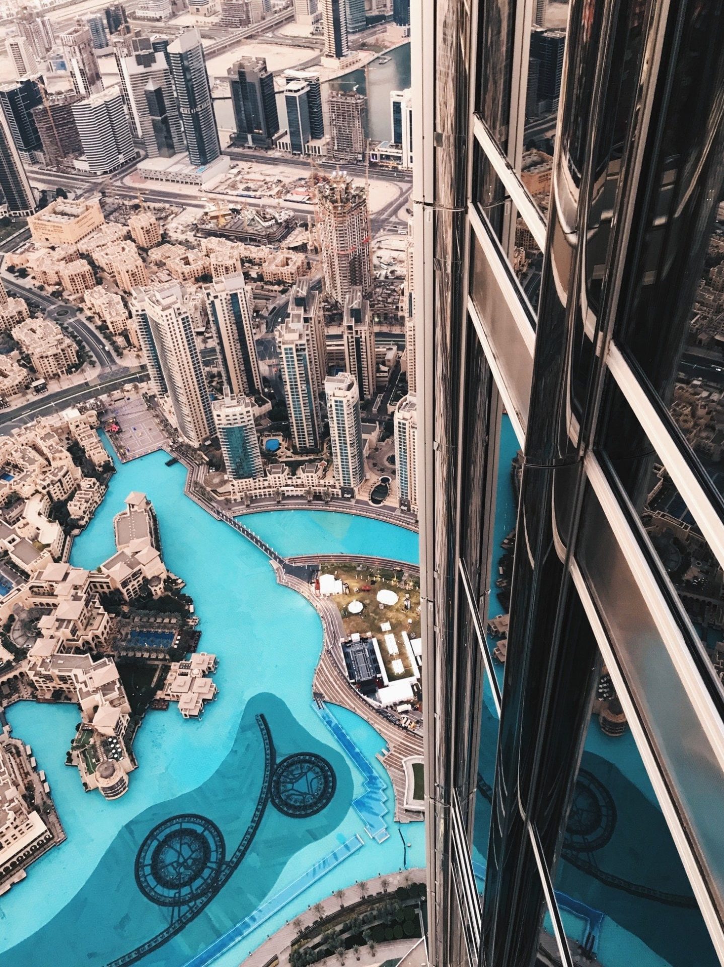 High angle view from Burj Khalifa overlooking downtown Dubai and surrounding water features