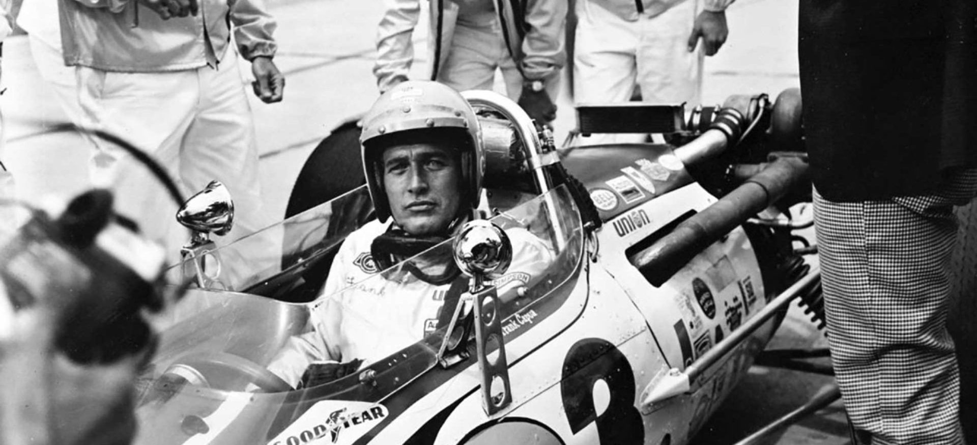 Historic racing driver image representing the motorsport origins of the Rolex Daytona