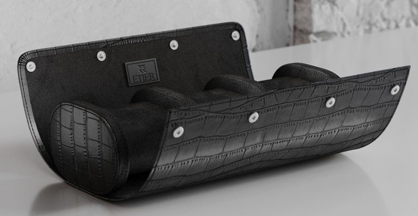Black leather watch roll designed for secure storage of multiple watches, combining protection, organisation and luxury design