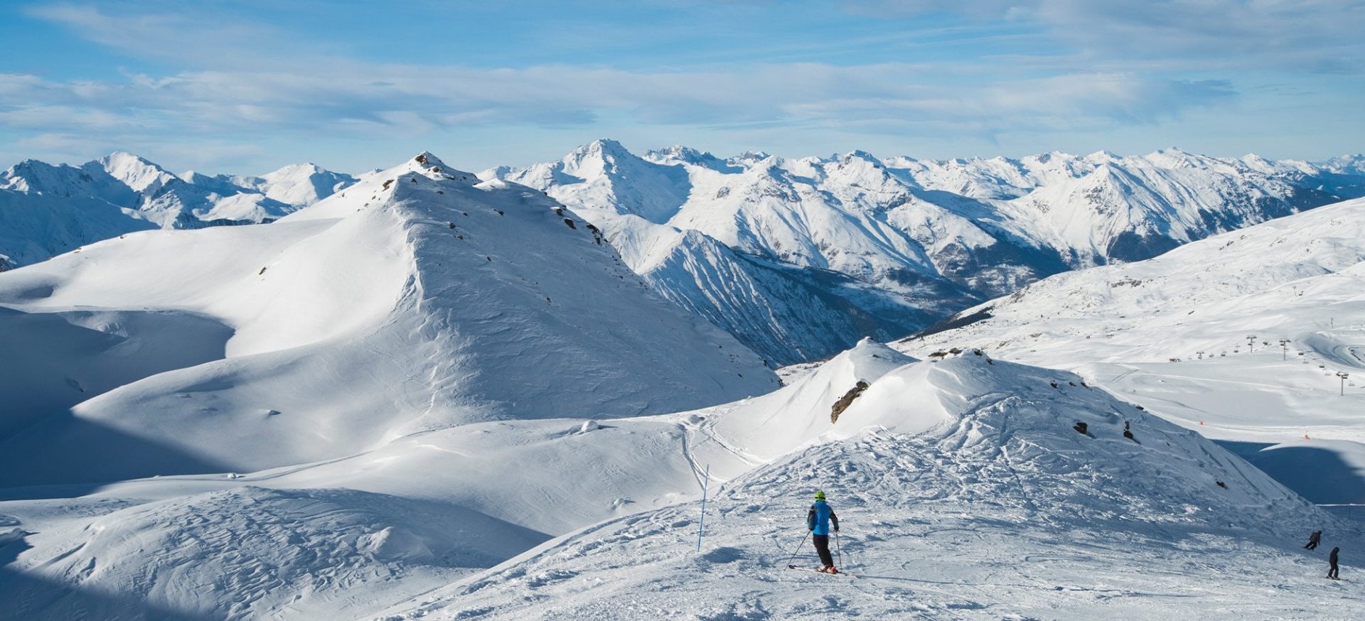 Panoramic view of Courchevel ski slopes and snow-covered mountains