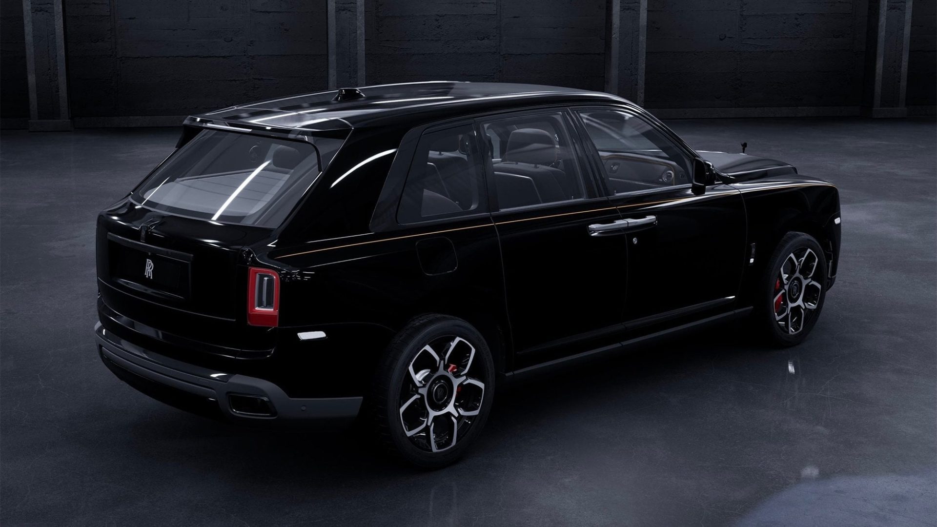 Rear three-quarter view of Rolls-Royce Black Label showcasing bespoke black exterior and luxury SUV design